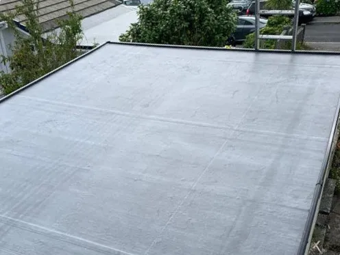 Flat roof underlay being installed on a property