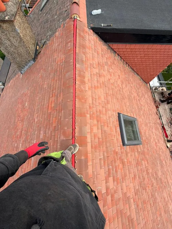 Fred Woodward, Director of Dragon Elite Roofing & Plastics standing on roof