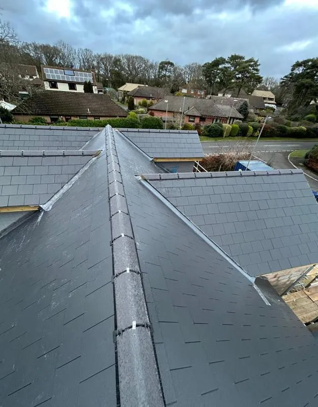 Large residential slate roofing installation