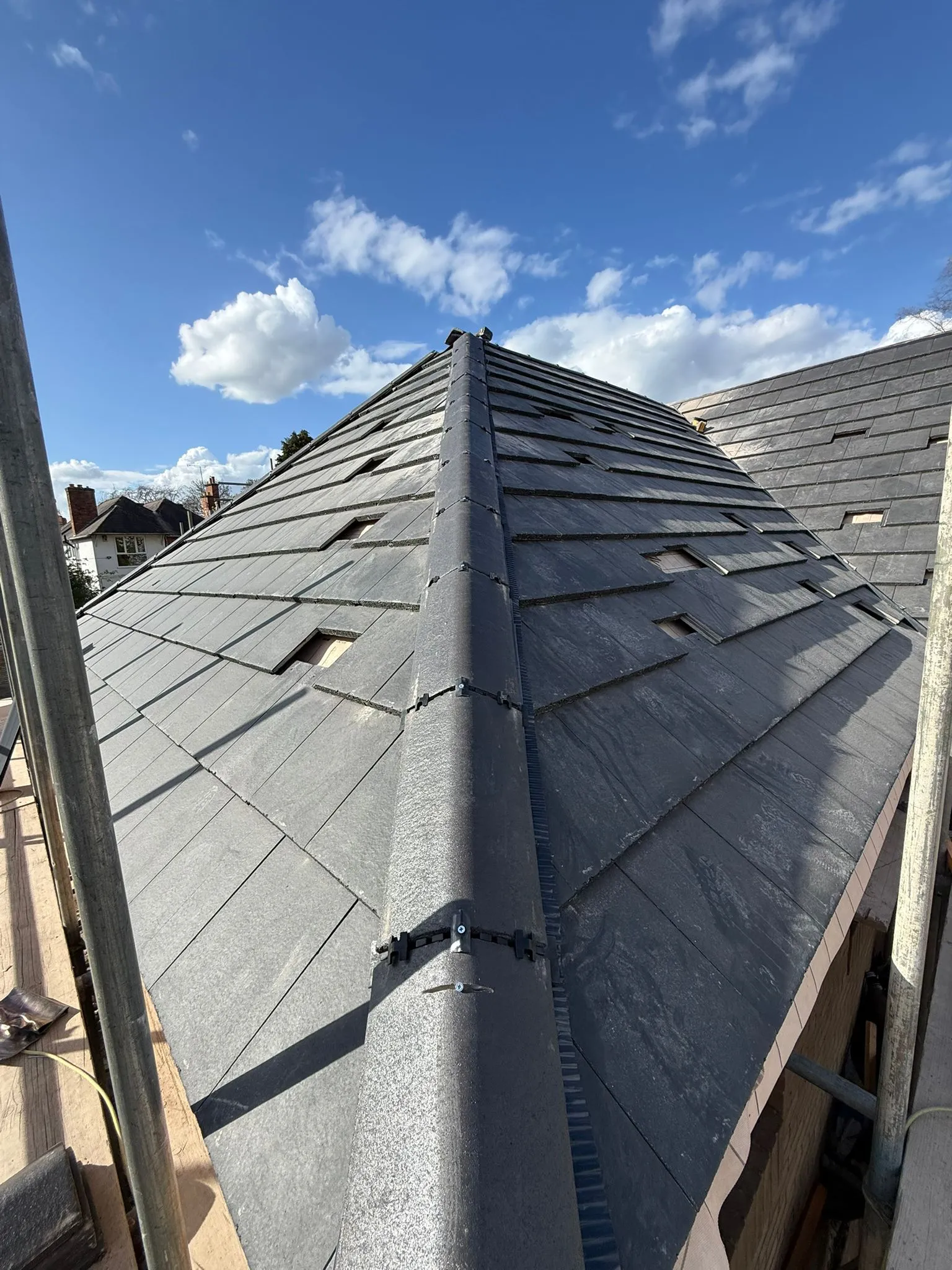 Shropshire slate roof with missing slates being replaced