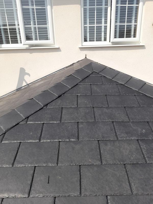 Slate tiles and ridge on extension roof