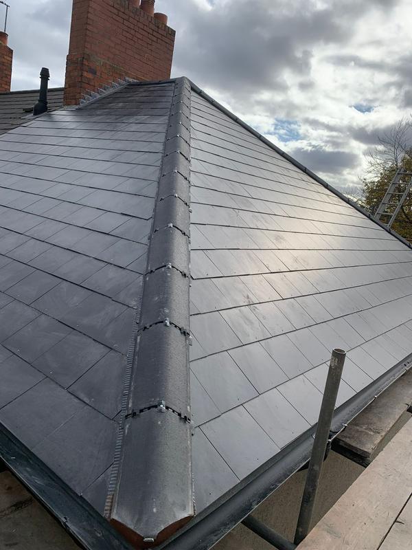 New slate roof installation on residential property