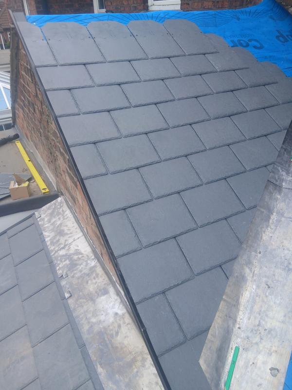 Slate tiles with underlay being installed on residential property