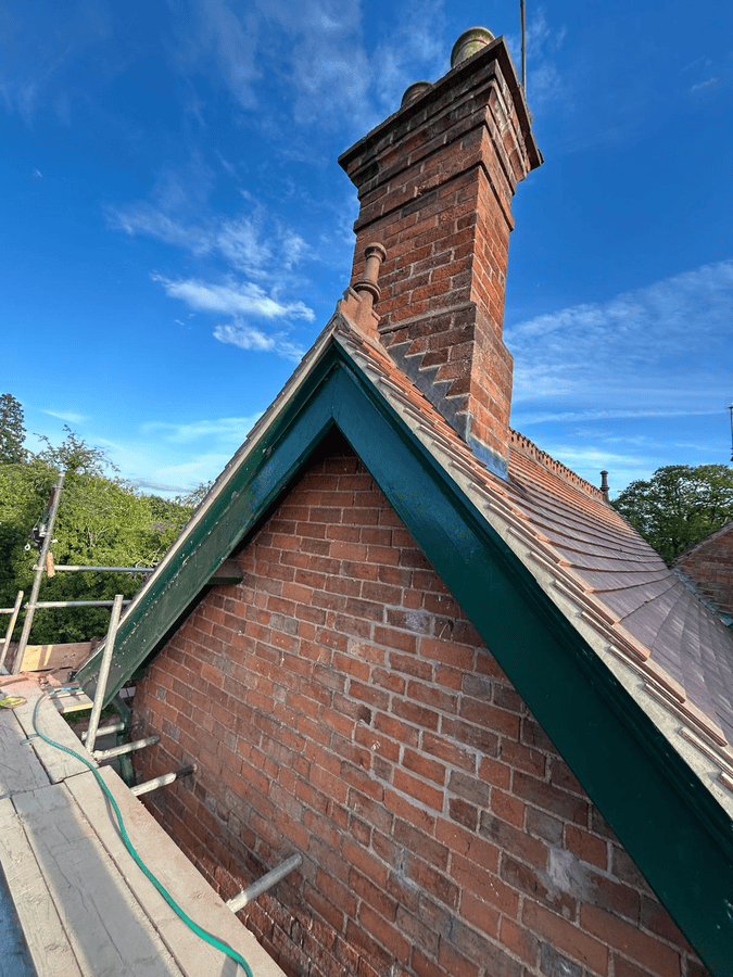 Old brick chimney repair on home