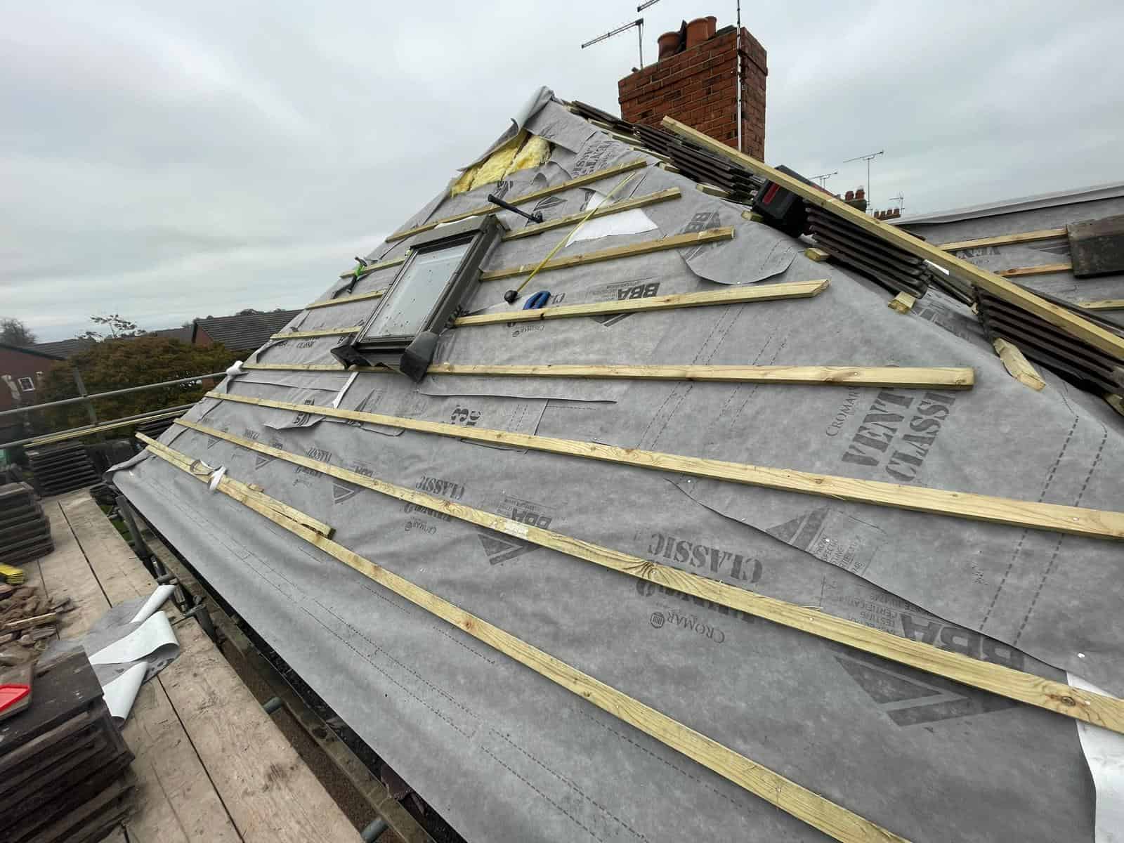 Re-roofing and weatherproofing roof with skylight