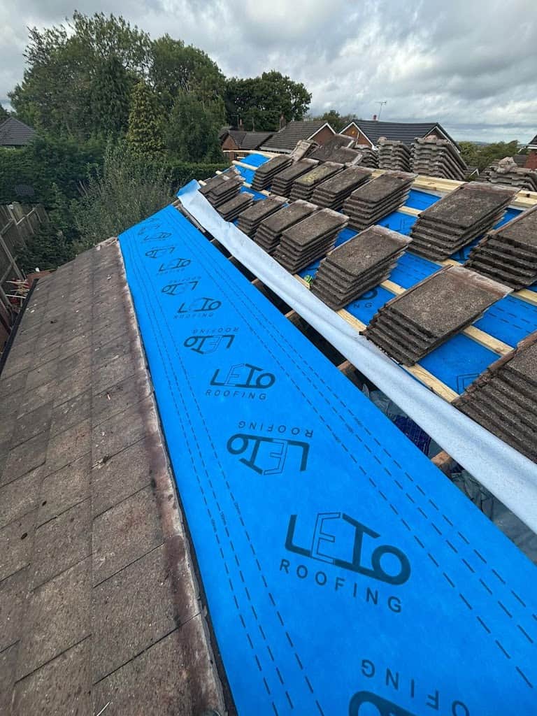 Roof tiles stacked up while weatherproofing is installed