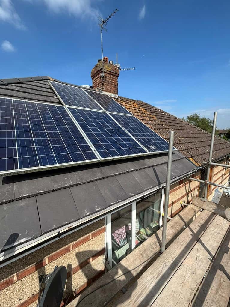 Roof work on semi detached home with solar panels installed